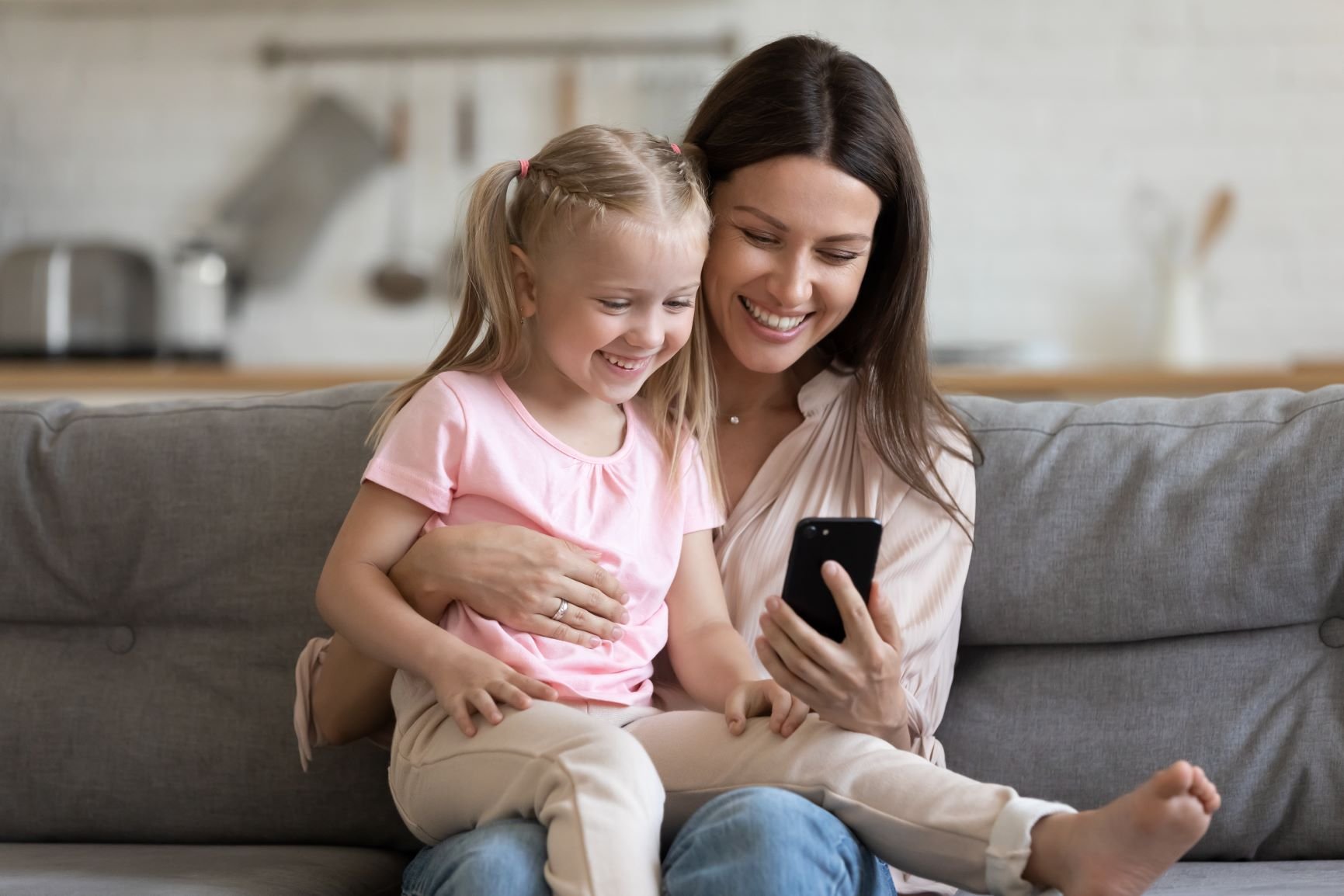 Mother and child looking telepsychiatry  app