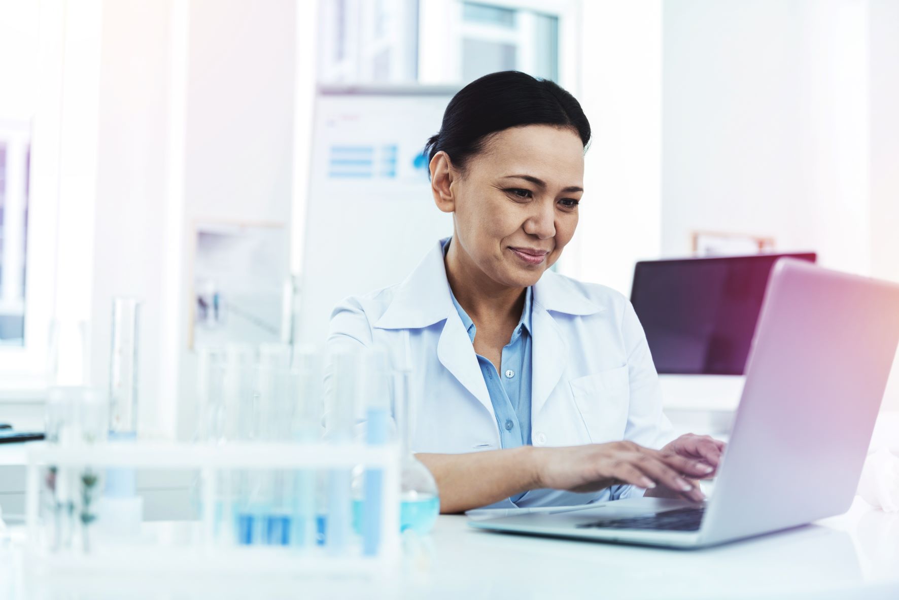 Clinical trial Researcher using laptop small