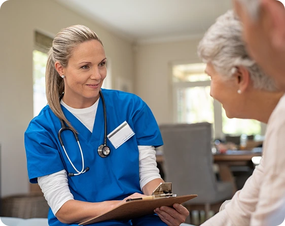 Nurse caring for patient thanks to automated care coordination that improves outcomes and provides more time for care.